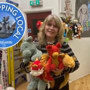 Owner Elaine Moodie holds three soft toys to represent 2024 – the Year of the Dragon.