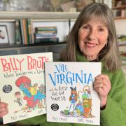 Somerset-author Issy Emeney with her two children's cautionary tales.