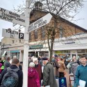 Protesters gathered in Wiveliscombe Town Square to oppose planned cuts to the 25 bus route.