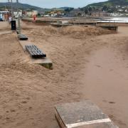 800 tons of sand were cleared from the Minehead seafront today