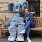 Rhian Mannings with the charity's mascot, George.