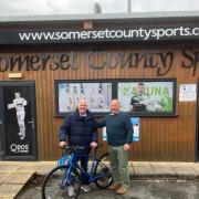Richard Brice on his bike (left) with Joe Mason outside Somerset County Sports Shop in Taunton.