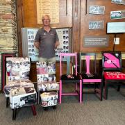 Stuart Tudball in the Somerset Cricket Museum along with the four bespoke pieces of Somerset CCC themed furniture