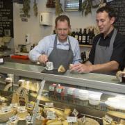 SIR Graham Watson MEP, left, enjoys some West-Country cheese at St Nick’s Market in Bristol. PHOTO: Gareth Iwan Jones.