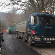 REOPENED: The green machine in the background has been imported in from Germany to carry out the resurfacing job at Porlock Hill