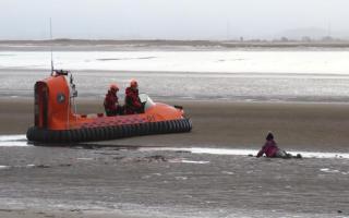 Woman being rescued after being stuck in the mud by the BARB Team. Image Credits: BARB Search and Rescue Burnham-on-Sea