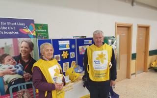 Minehead Rotary collecting for Marie Curie Charity. Andrew and Jane in the frame.