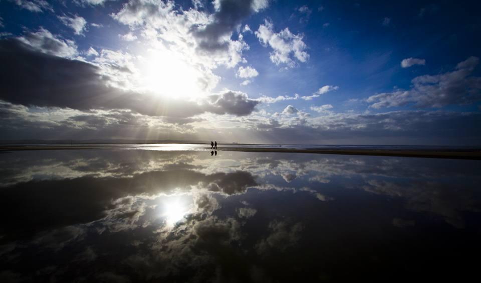 REFLECTIONS: Walkers on the beach at Burnham-on-Sea. PICTURE: Tiny Tina. PUBLISHED: March 16, 2017